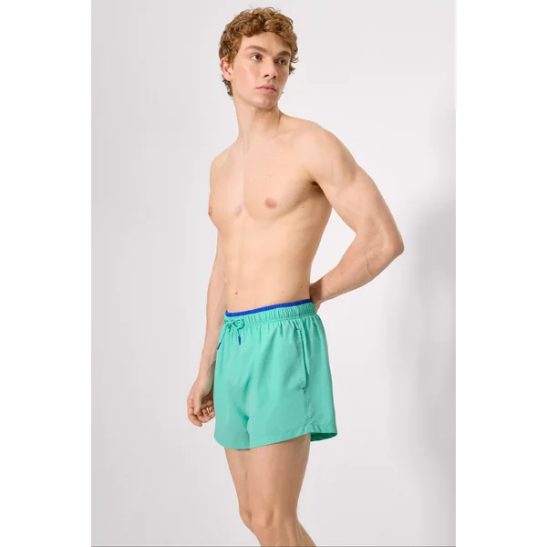 Maillot de bain court avec détail bleu à la taille