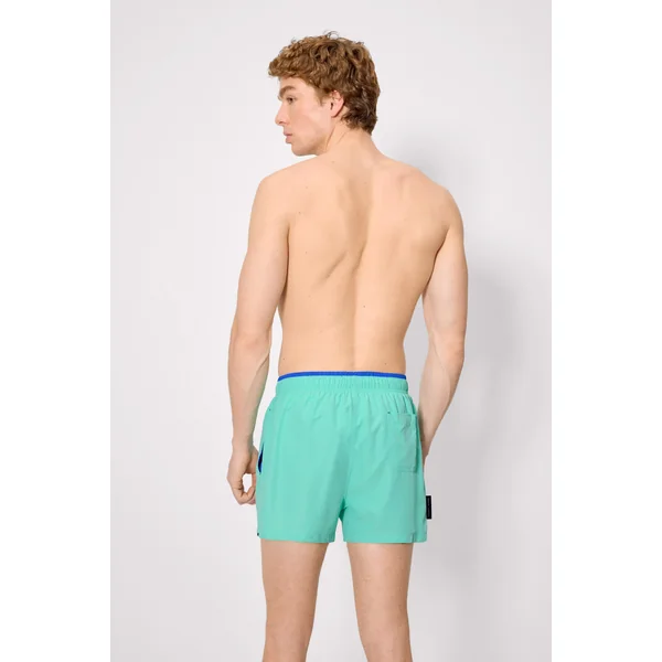 Maillot de bain court avec détail bleu à la taille
