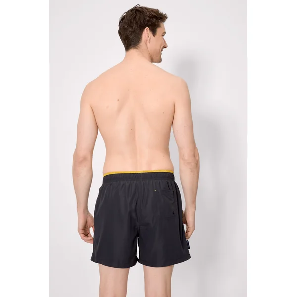 Maillot de bain une pièce noir, avec détail à la taille.