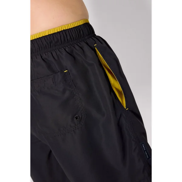 Maillot de bain une pièce noir, avec détail à la taille.