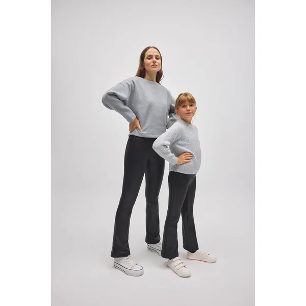 Pantalon thermique évasé noir effet cuir pour fille